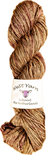 Load image into Gallery viewer, WeStYarn Silky Singles skein in the light brown colorway Frappé. With red speckles
